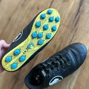 Kids  black puma outdoor soccer shoe unisex girls boys